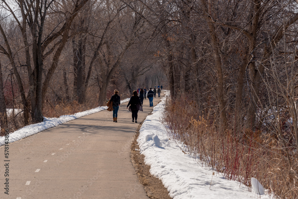 Walkers Enjoying The Fox River Trail In De Pere, Wisconsin, In Warm Winter Weather Walkers Enjoying The Fox River Trail In De Pere, Wisconsin, In Warm Winter Weather