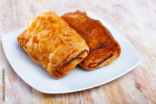 Puff pastry pie with meat and cheese, spanish pastry napolitana