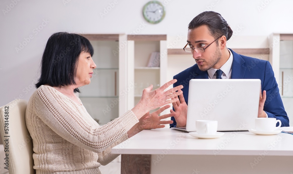 Male real estate agent and female client in the apartment Male real estate agent and female client in the apartment
