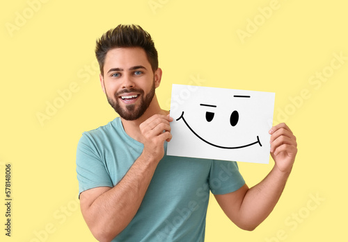 Happy young man holding pap...