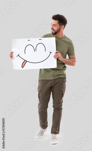 Handsome young man holding ...