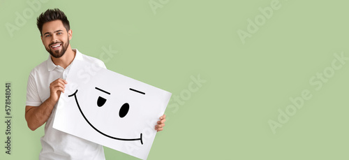 Happy young man holding pap...