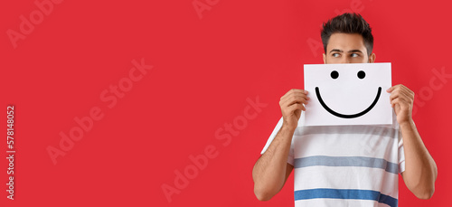 Handsome young man holding ...