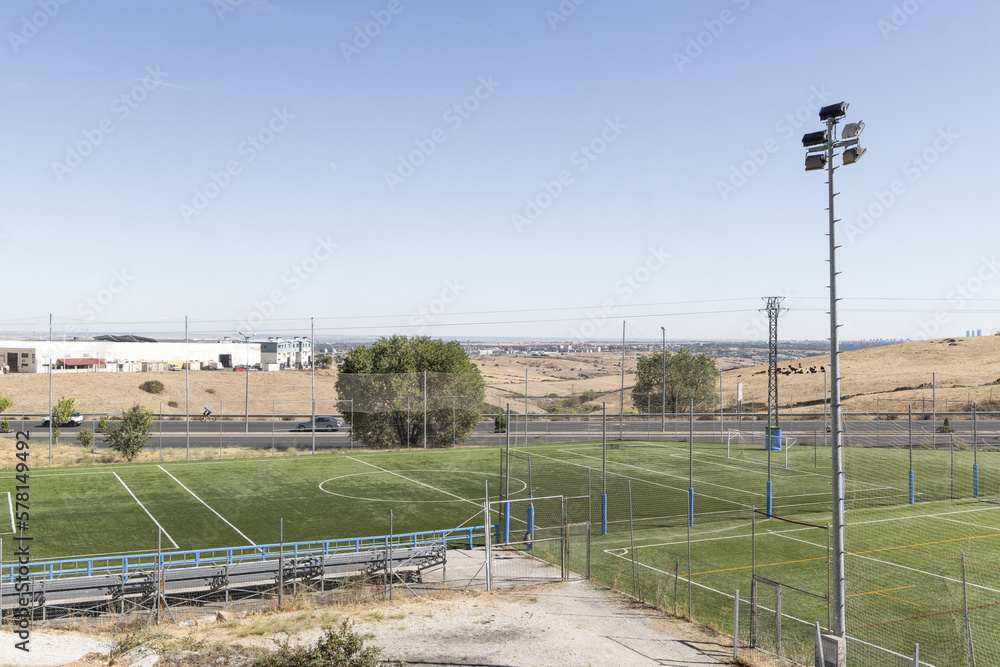 Several grass soccer training fields for youth and children's teams with lamp posts for lighting Several grass soccer training fields for youth and children's teams with lamp posts for lighting