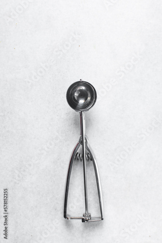 Silver cookie scoops on a white background, Top view of cookie scoops used for ice cream or cookie dough