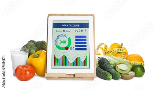 Tablet with weight loss calculator application, measuring tape and food products on white background