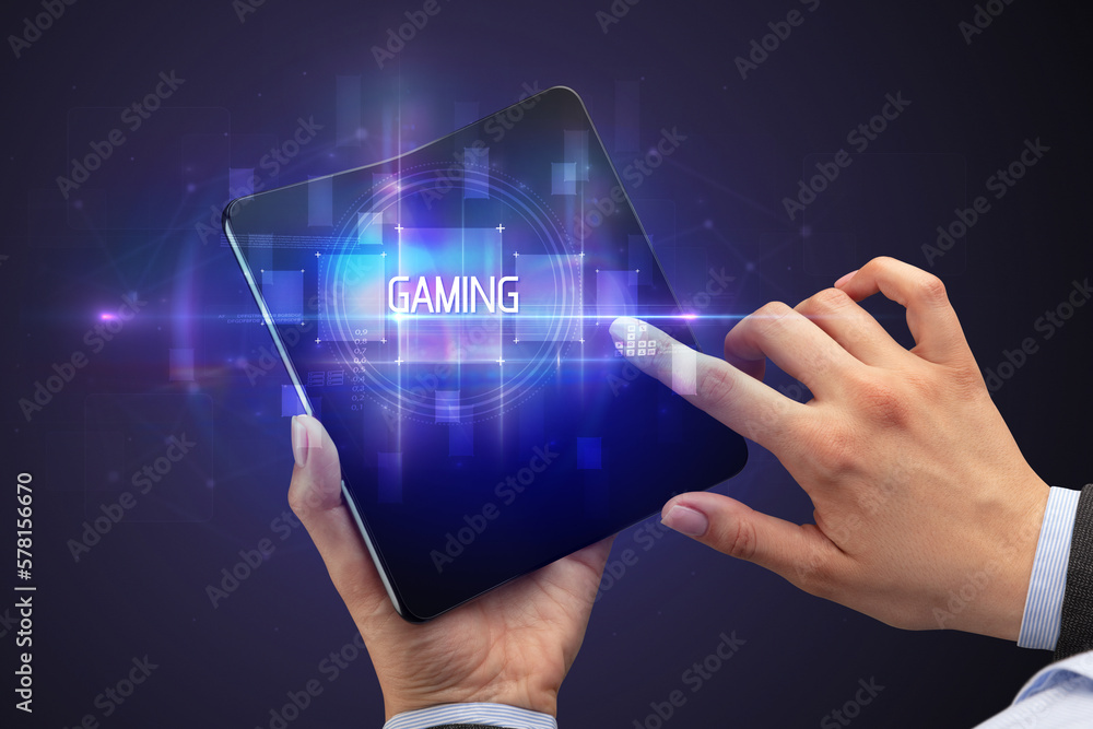 Businessman holding a foldable smartphone Businessman holding a foldable smartphone