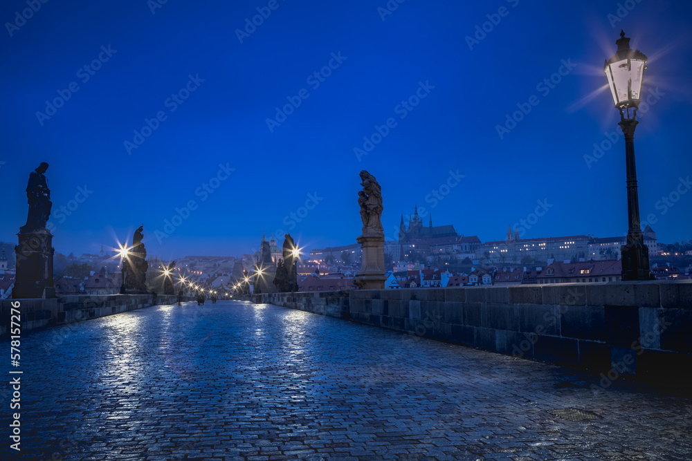 Charles Bridge, Prague at dramatic evening, Czech Republic, with night lighting