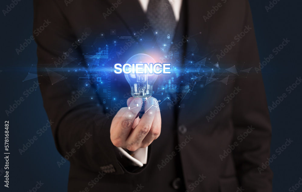 Businessman holding a light bulb Businessman holding a light bulb