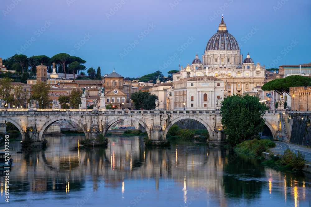 Rome Skyline at Dusk with an Arched Bridge over the Tiber River and Roman Hill in the Background. 