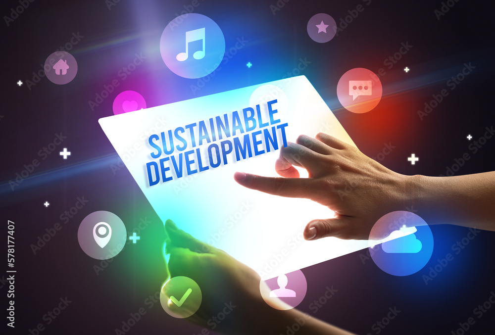 Holding futuristic tablet, new media concept Holding futuristic tablet, new media concept