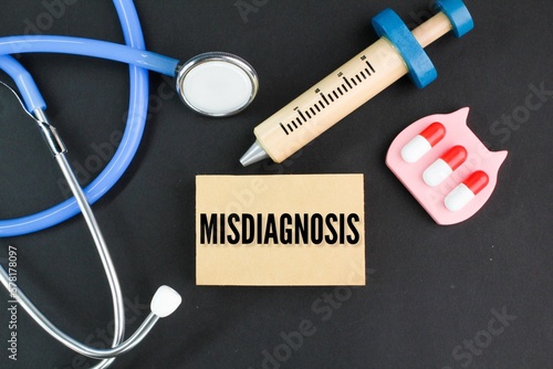 stethoscope, needle shape and medicine with the word Misdiagnosis. health and medical concepts