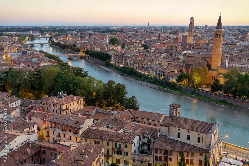 Aerial Skyline View of Verona, Italy at Sunset. Verona offers travelers the opportunity to visit grand buildings with unique architecture, squares lined with outdoor restaurants and Roman ruins.
