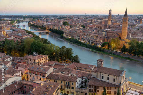 Aerial Skyline View of Verona, Italy at Sunset. Verona offers travelers the opportunity to visit grand buildings with unique architecture, squares lined with outdoor restaurants and Roman ruins.  © Cindy