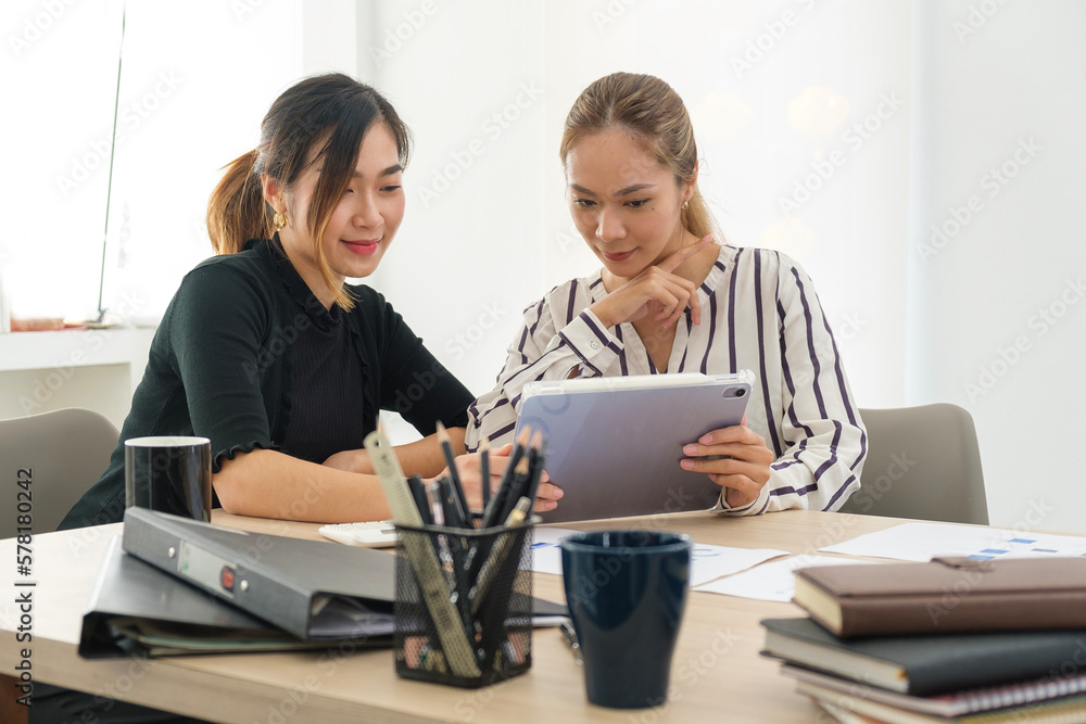 Obraz premium Image of female colleagues discussing results or presenting new project on laptop.