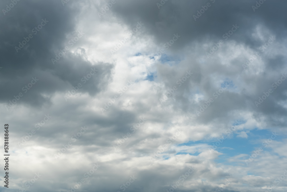 Bright blue sky with dark clouds before the rain. Beauty of nature. Aerial natural background