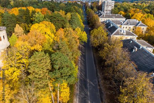 City buildings immersed in bright autumn foliage from the air © PhotoChur