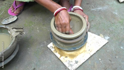 Wallpaper Mural Close up shot of Bangladeshi woman producing clay pottery in a traditional style in a small village near Khulna. Bangladesh. Torontodigital.ca