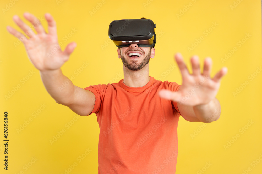 Naklejka premium Happy caucasian man with Virtual Reality goggles