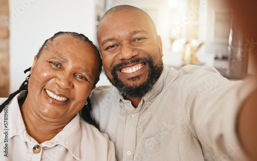 Smile, selfie and mature black couple in home with happiness and love in relationship together. Self portrait, happy face and man with woman taking romantic picture for social media in South Africa. © Jesse Bettencourt/peopleimages.com