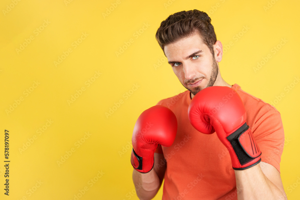 Caucasian man with boxing gloves in fight pose