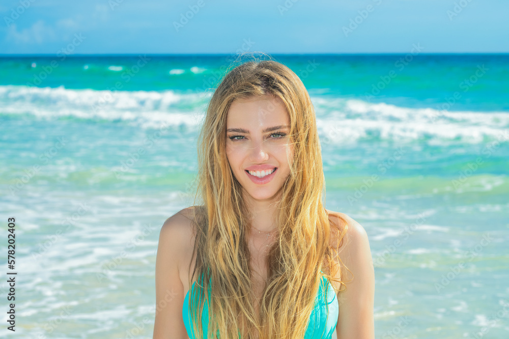 Beautiful woman relax outdoor on sea ocean view. Traveller woman in swimsuit on beautiful sandy beach. Cute girl enjoy her tropical sea on relax holiday vacation during summer day. Beautiful woman relax outdoor on sea ocean view. Traveller woman in swimsuit on beautiful sandy beach. Cute girl enjoy her tropical sea on relax holiday vacation during summer day.
