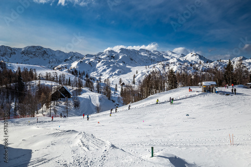 Bohinj, Slovenia - Vogel ski resort in Bohinj in Julian Alps on a sunny winter day with ski slope, blue sky and clouds