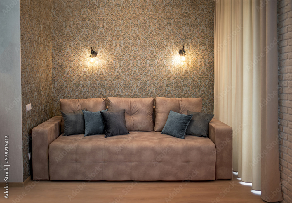 Fototapeta premium interior of modern studio living room, open plan living room and kitchen interior with gray sofa with cushions