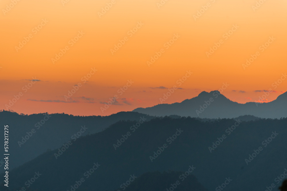 Sunset mountain range beautiful landscape mist, dusk golden time dramatic sky. Beautiful landscape high mountain ridge mist panning panorama scenery dawn dramatic sky. Sunrise landscape mountain peak.