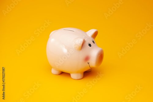 Close-Up Of Pink Piggy Bank isolated on Orange background. Saving money for future plan and retirement fund. Business or finance saving and investment money.