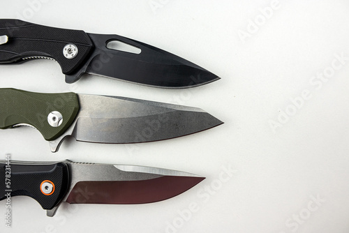 Three tactical combat knives isolated on white photo