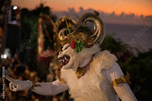 Close-up of a person in a monkey costume which is supposed to represent kumbakarna during a Hindu ritual at the Pura Luhur temple in Uluwatu, Bali.