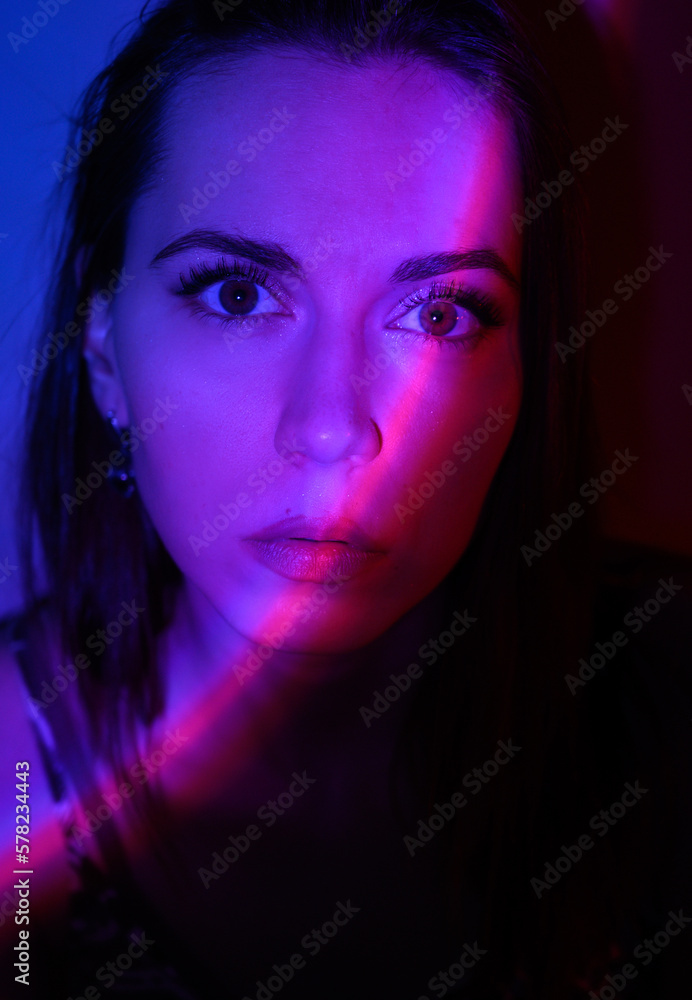 Abstract portrait of a woman with colored light.