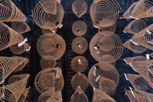 Looking up at incense coils in the roof of a Chinese Buddhist temple on Cholon district of Ho Chi Minh City, Vietnam