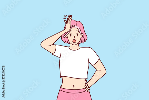 Forgetful shocked girl clutching head, opens mouth wide remembering about things not done or keys forgotten at home. Shocked woman with pink hair is stressed by piled problems and troubles