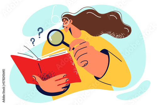 Curious woman student with magnifying glass studies literature and books in library 