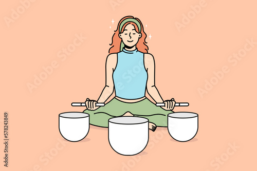 Calm woman sit in lotus pose meditate with singing bowls. Relaxed female engaged in meditation with Himalayan bowls. Stress relief concept. Vector illustration. 