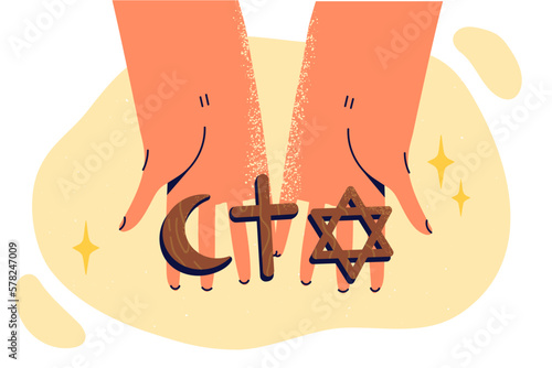 Human hands with religious amulets for believers of Islamic and Christian religion or Judaism