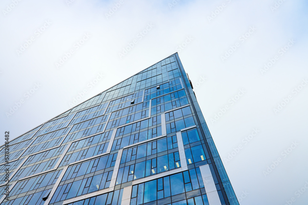Modern office building glass facade. Skyscraper exterior. Architecture details. Modern office building glass facade. Skyscraper exterior. Architecture details.