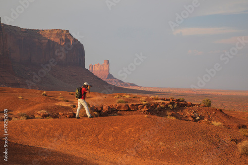 Man Photographing at Monument Valley environment photo