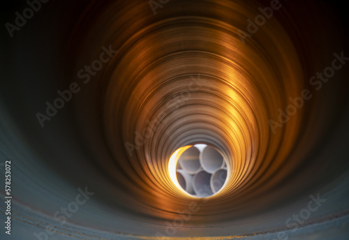 Interior of Metal pipeline photographed with depth of field effect