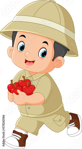 an adventurous boy excited and running carrying lots of apples