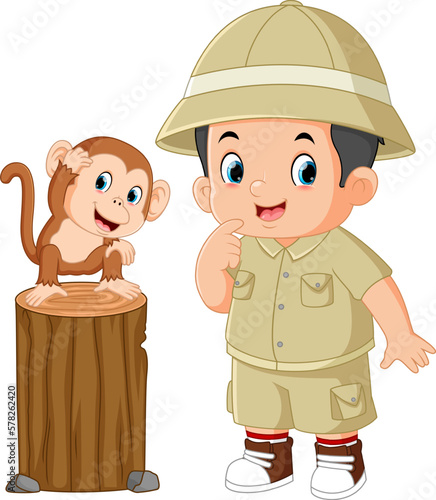 an adventurous boy is posing with a baby monkey