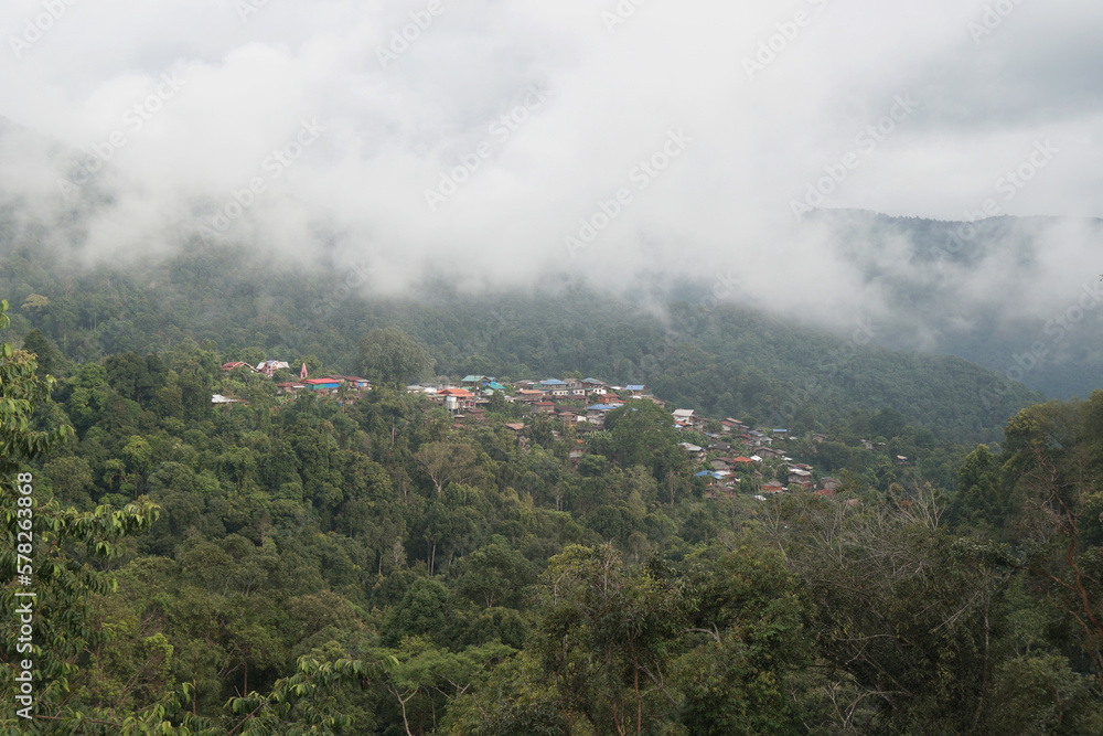 Landscape Green nature of Green Mountain with Traditional Thai House seen at Doi Sakad Pua  Nan Thailand in Rainy Season