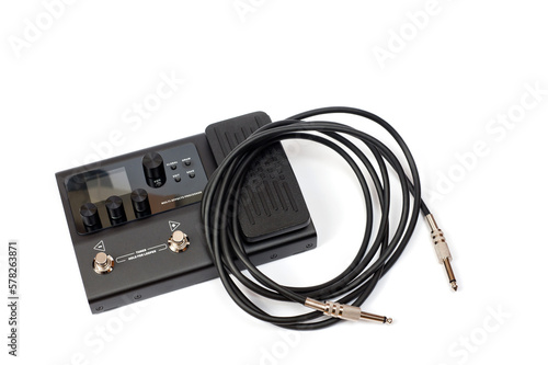 Guitar processor in a metal case for playing electric, acoustic and bass guitars. photo