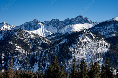 View of the Tatra Mountains in winter from Rusinowa Polana. Sunny weather during a hike in the mountains.