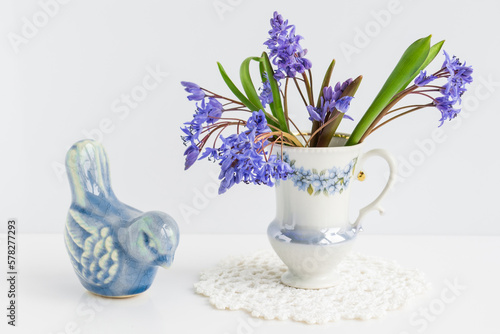 delicate bouquet of first spring flowers on a white background