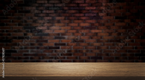 Photo wooden table table at foreground with blurred old brown brick wall as background, brick wall texture