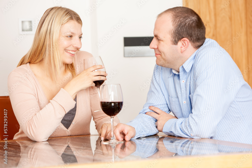 Family Life, Dinner Date. A married couple reconnecting and enjoying each others company and a glass of wine at home. From a series of related images. Family Life, Dinner Date. A married couple reconnecting and enjoying each others company and a glass of wine at home. From a series of related images.
