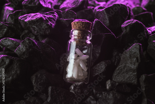 A miniature glass bottle filled with rice grain. Glass container with a corkscrew. Food background.  Vegetarian lifestyle photo